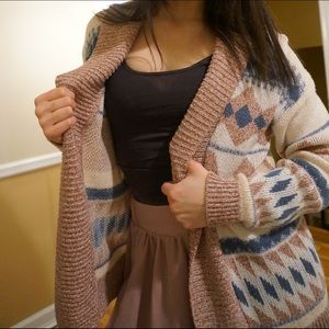 Beige and blue cardigan.